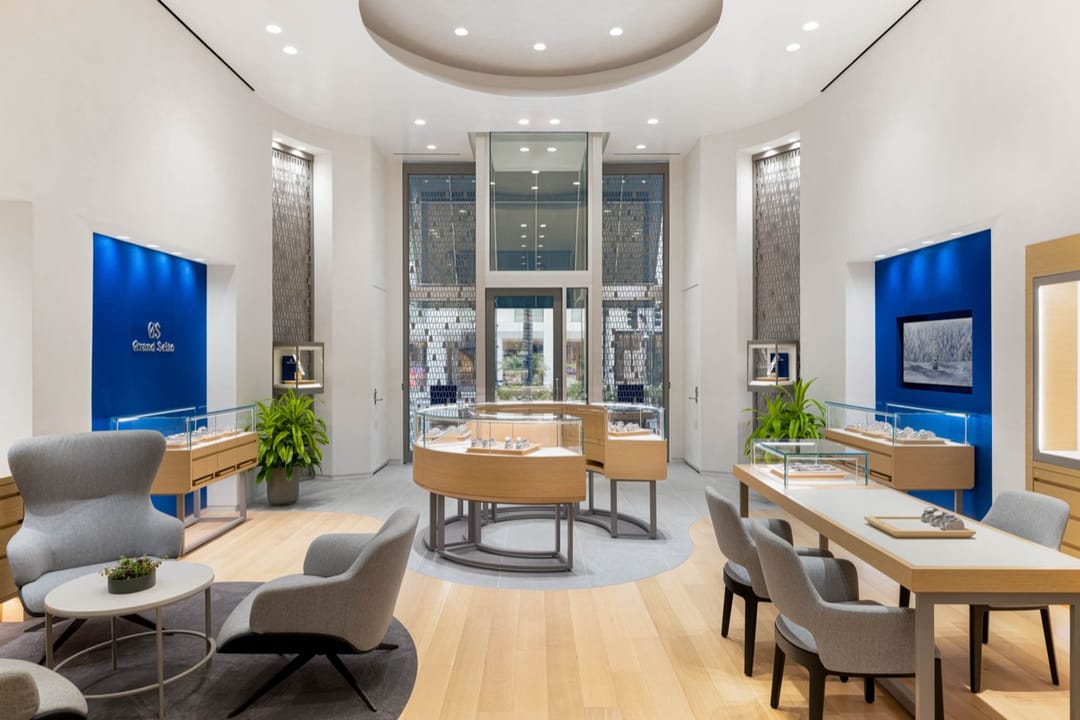 Grand Seiko boutique seen from the back toward the entrance, blue walls on both sides