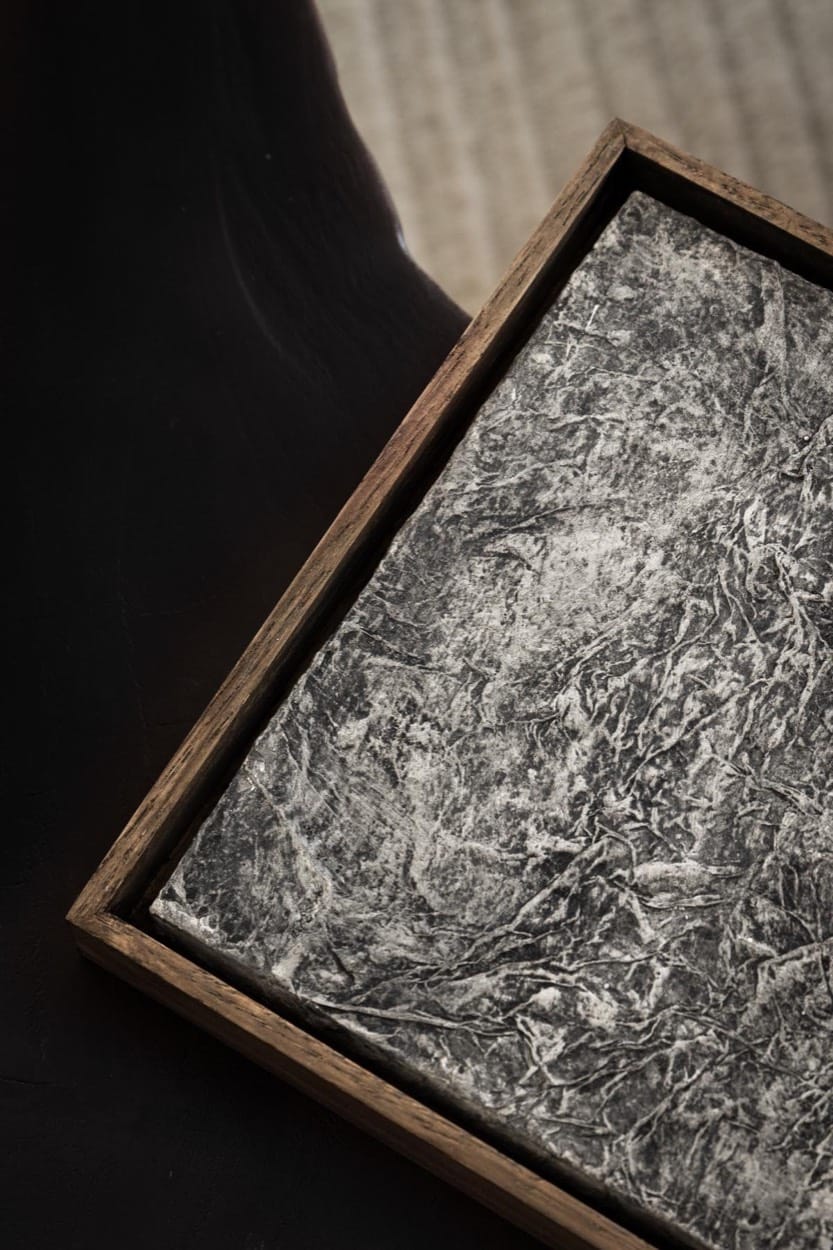Close-up of a framed stone-texture artwork by Jane Kidder