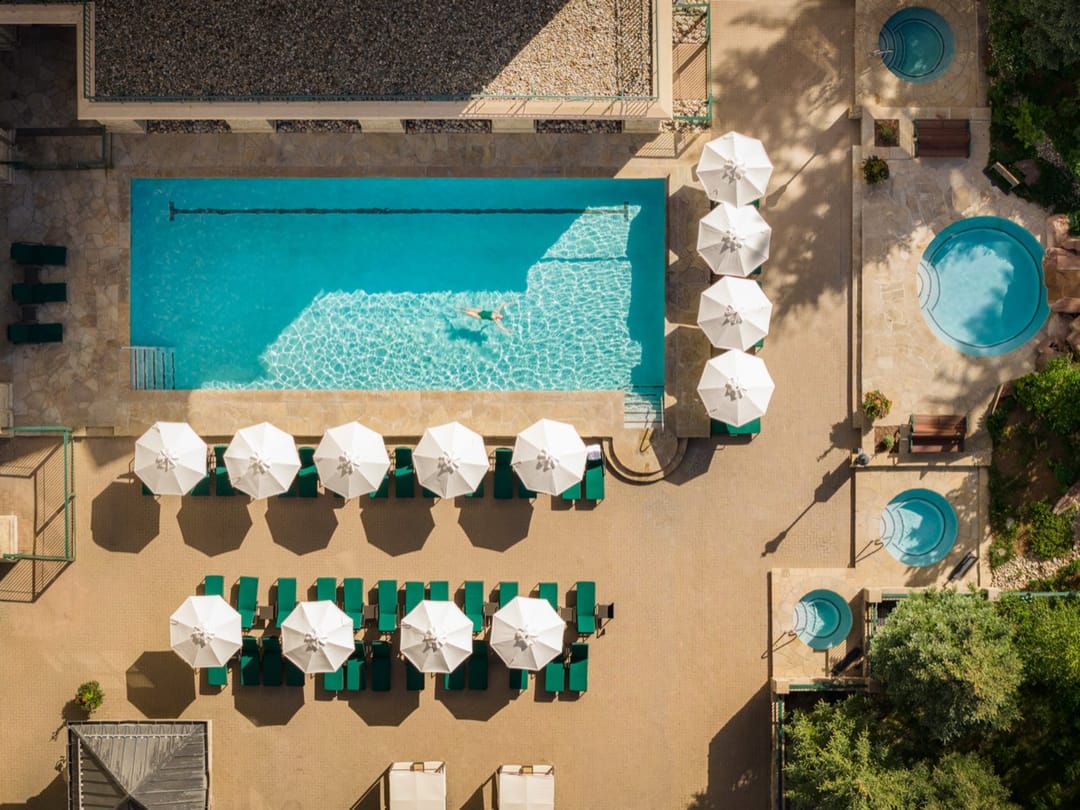Pool deck with white umbrellas from directly above, Park Hyatt Beaver Creek