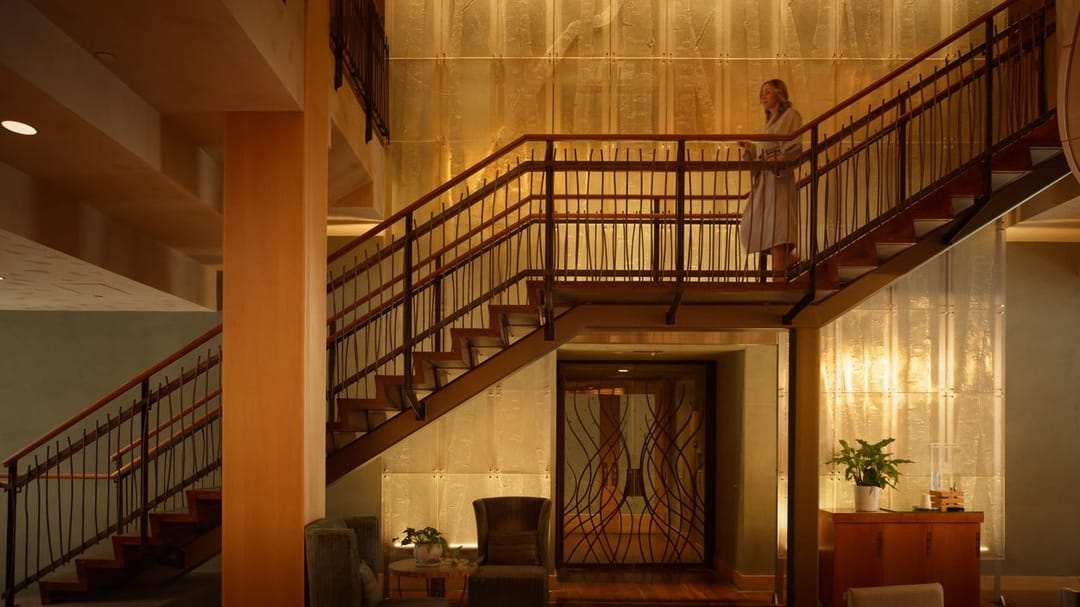 Wood and glass staircase inside Park Hyatt Beaver Creek, from the summer film