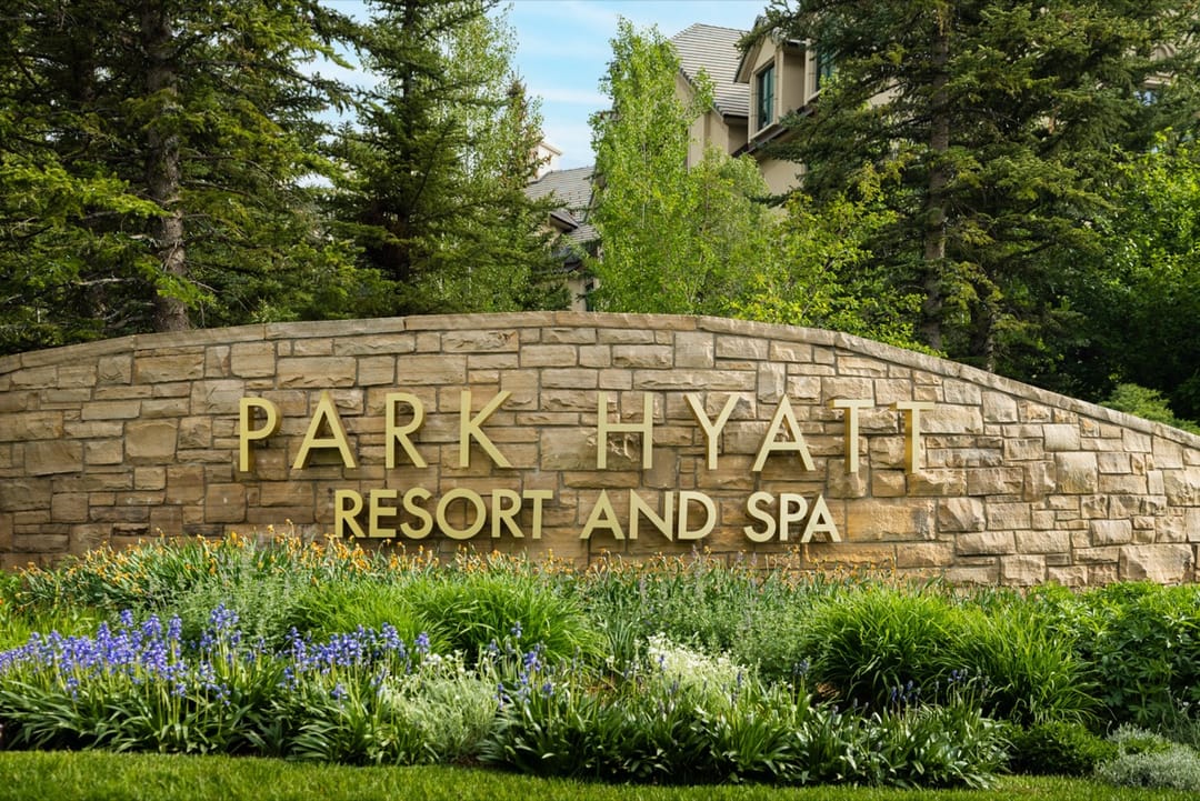 Park Hyatt Resort and Spa stone sign above summer flowers