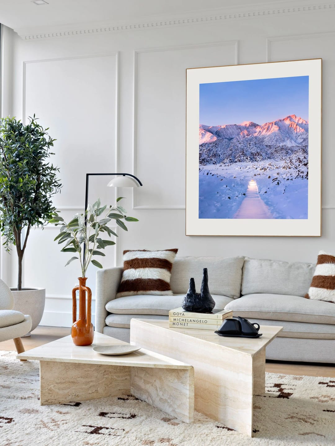 Winter Road framed above a sofa in a white living room